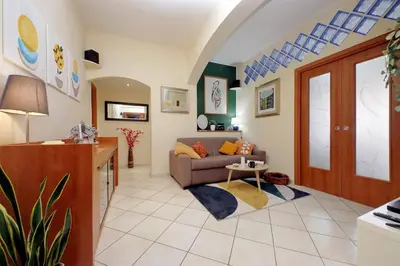 a living room with a couch and a table at Rome Family Comfort Hub in Rome