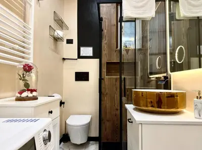 a bathroom with a sink and a toilet and a mirror at CHANGE S house, Few stops from St Peter s in Rome
