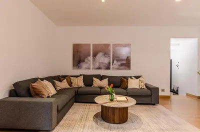 a living room with a couch and a table at Domus Urbana 152 in Rome