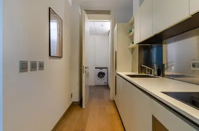 a kitchen with a sink and a washing machine at Domus Urbana 152 in Rome
