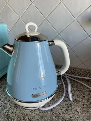 a blue tea kettle sitting on a kitchen counter at Villa Carpegna House 10 Minuti from Vatican San Peter in Rome