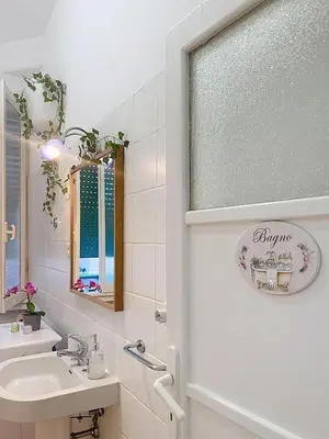 a bathroom with a sink and a mirror at Villa Carpegna House 10 Minuti from Vatican San Peter in Rome