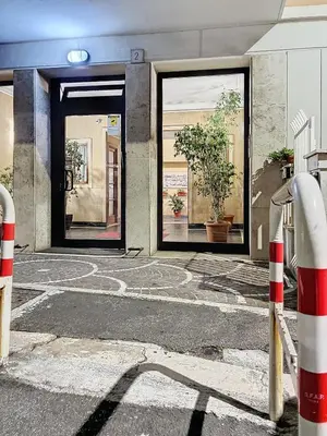 a building with a maze in front of two doors at Villa Carpegna House 10 Minuti from Vatican San Peter in Rome