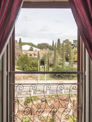 a window with a view of a yard at Royal Rooms in Rome