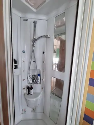 a bathroom with a shower and a toilet and a sink at Incantevole bilocale a Città Giardino in Rome