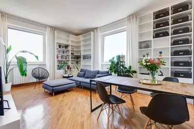 a living room with a large table and chairs at Romaviva Luxury Attic Apartment - San Giovanni in Laterano - Metro A C - Central Rome in Rome