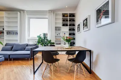 a living room with a table and chairs at Romaviva Luxury Attic Apartment - San Giovanni in Laterano - Metro A C - Central Rome in Rome