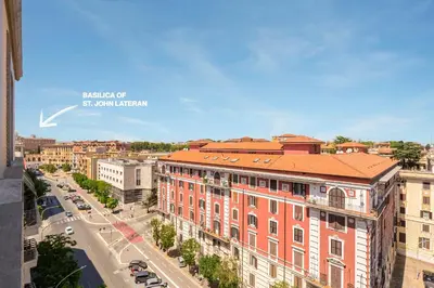 an aerial view of a city with buildings and a street at Romaviva Luxury Attic Apartment - San Giovanni in Laterano - Metro A C - Central Rome in Rome