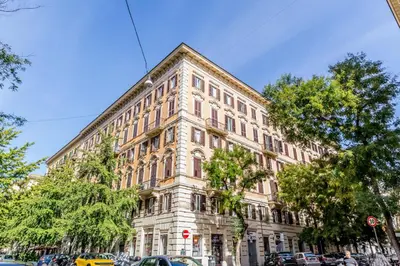 a large building on the corner of a street at Roma Vatican Suites Inn in Rome