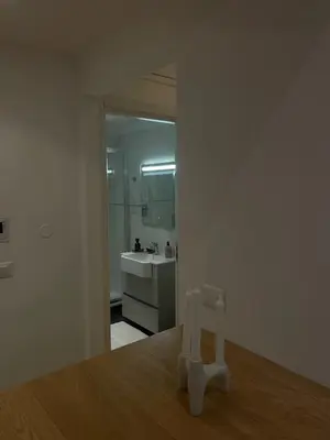 a room with a bathroom with a sink and a mirror at Forte's Apartment in Rome