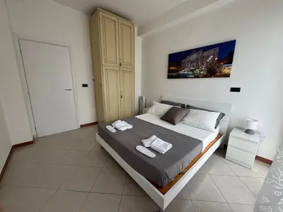 a bedroom with a bed with two towels on it at Vacanze Romane Apartment in Rome in Rome