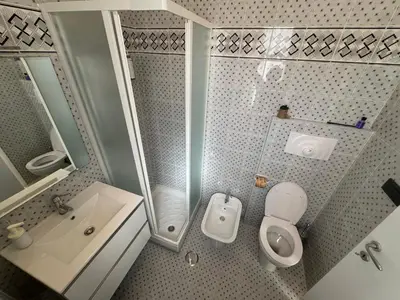a small bathroom with a toilet and a sink at Vacanze Romane Apartment in Rome in Rome