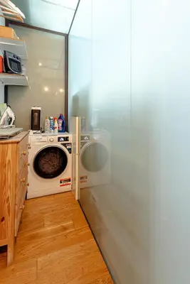 a laundry room with a washer and a washing machine at Piazza Venezia Suite and Terrace in Rome