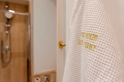 a white shower curtain with the words happy birthday on it at Piazza Venezia Suite and Terrace in Rome
