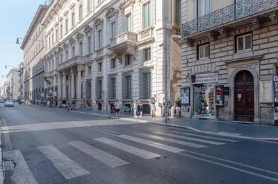 an empty street in a city with buildings at Piazza Venezia Suite and Terrace in Rome