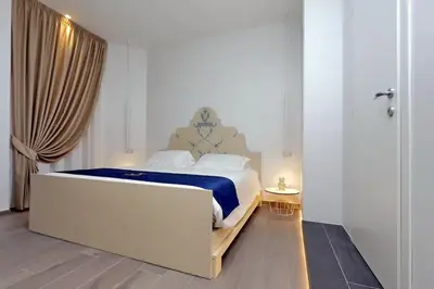 a bathroom with a shower with a toilet and a sink at Vatican Family Romantic Suite in Rome