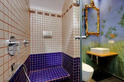 a bathroom with a sink and a mirror at Vatican Family Romantic Suite in Rome