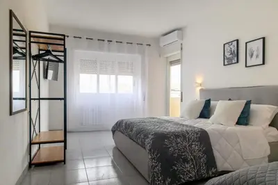 a bedroom with a bed and a mirror at Veroli Vacanze Romane in Rome
