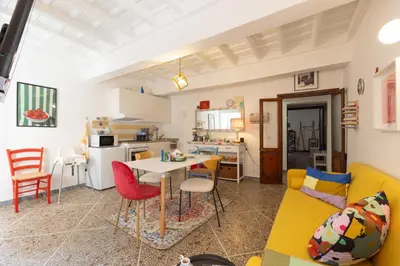 a living room with a couch and a table at Perduta a Rome in Rome