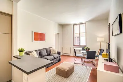 a living room with a couch and a table at Coliseum cozy flat in Rome