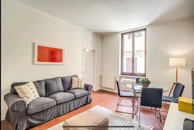 a living room with a couch and a table at Coliseum cozy flat in Rome
