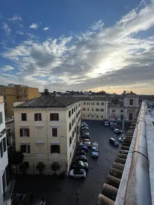 a view of a parking lot with cars parked in it at A Terrace With a View in Rome