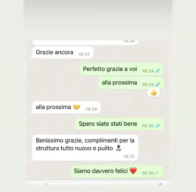 a screenshot of a text conversation with a sender at XCross Suites Basilica San Paolo in Rome