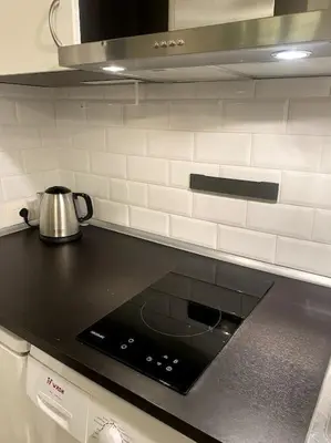 a kitchen with a stove with a tea kettle on it at Secret Garden in Rome in Rome
