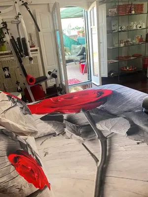 a room with a table in the middle of a room at Ave Roma Suite in Rome