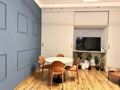 a dining room with a table and chairs at Boutique Trevi Apartment in Rome