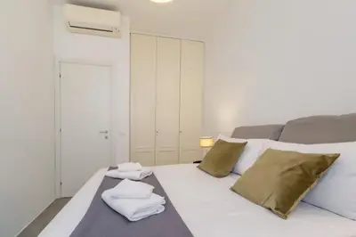 a bedroom with a bed with towels on it at Great Opera a Via Palermo in Rome