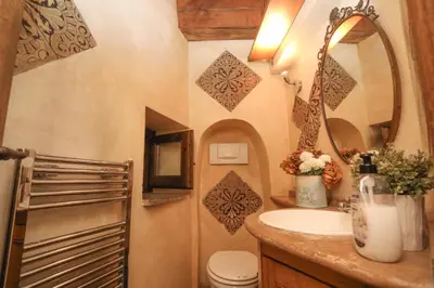 a bathroom with a sink and a toilet and a mirror at Domus Antica Navona in Rome