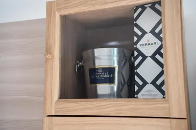 a metal container in a wooden drawer in a room at Garbatella Bridge Apartment in Rome