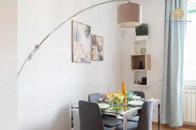 a dining room with a table and chairs at Giglio Dome View - St Peter View, 300mt to Metro A, Vatican City, A-C in Rome