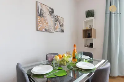 a dining room table with plates and fruit on it at Giglio Dome View - St Peter View, 300mt to Metro A, Vatican City, A-C in Rome