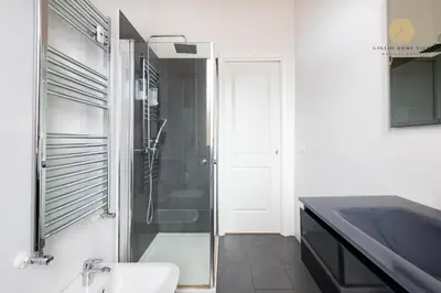 a bathroom with a shower and a toilet and a sink at Giglio Dome View - St Peter View, 300mt to Metro A, Vatican City, A-C in Rome