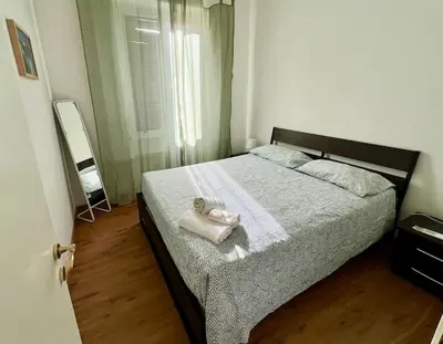 a bedroom with a bed with a white towel on it at Casa degli Effetti in Rome