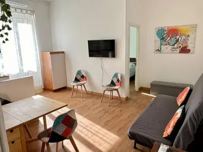 a living room with a couch and two chairs at Casa degli Effetti in Rome
