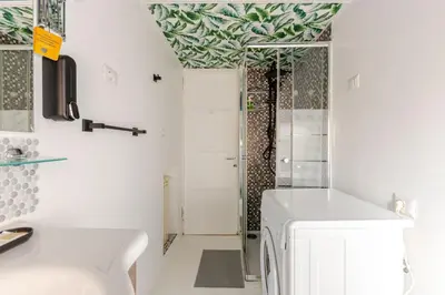 a bathroom with a white sink and a shower at Casa Cornelia 10 MIN to metro, near Vatican in Rome