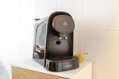 a coffee maker sitting on a shelf in a kitchen at Casa Cornelia 10 MIN to metro, near Vatican in Rome