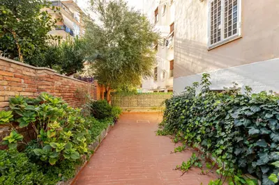 a brick walkway in front of a brick building at Casa Cornelia 10 MIN to metro, near Vatican in Rome