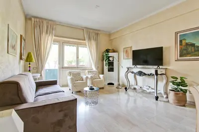 a living room with a couch and a tv at Elle House in Rome