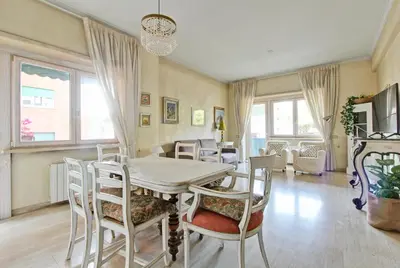 a dining room with a table and chairs at Elle House in Rome