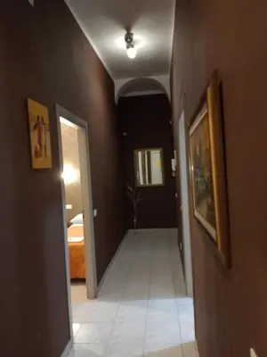 a hallway leading to a room with a hallway at Moon and Sun LT Apartament in Rome