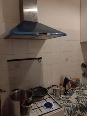 a kitchen with a stove and a counter top at Moon and Sun LT Apartament in Rome