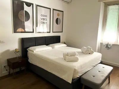 a bedroom with a bed with two towels on it at Viale4Venti in Rome