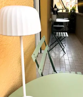 a lamp sitting on top of a table next to a room at Viale4Venti in Rome