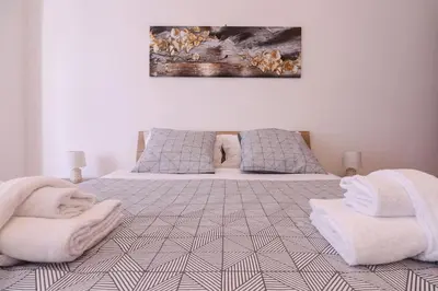 a bedroom with a bed with white towels on it at We Home - La Dimora di Portonaccio - Roma in Rome