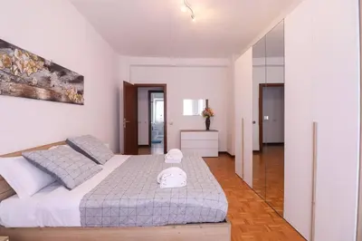 a bedroom with a large bed in a room at We Home - La Dimora di Portonaccio - Roma in Rome