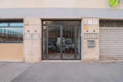 an entrance to a building with a glass door at We Home - La Dimora di Portonaccio - Roma in Rome